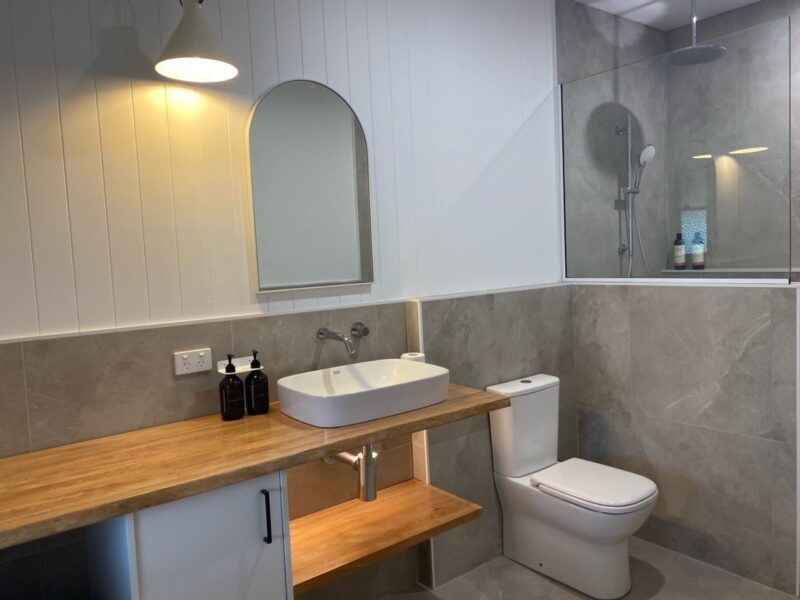 bathroom showing shower, toilet and basin