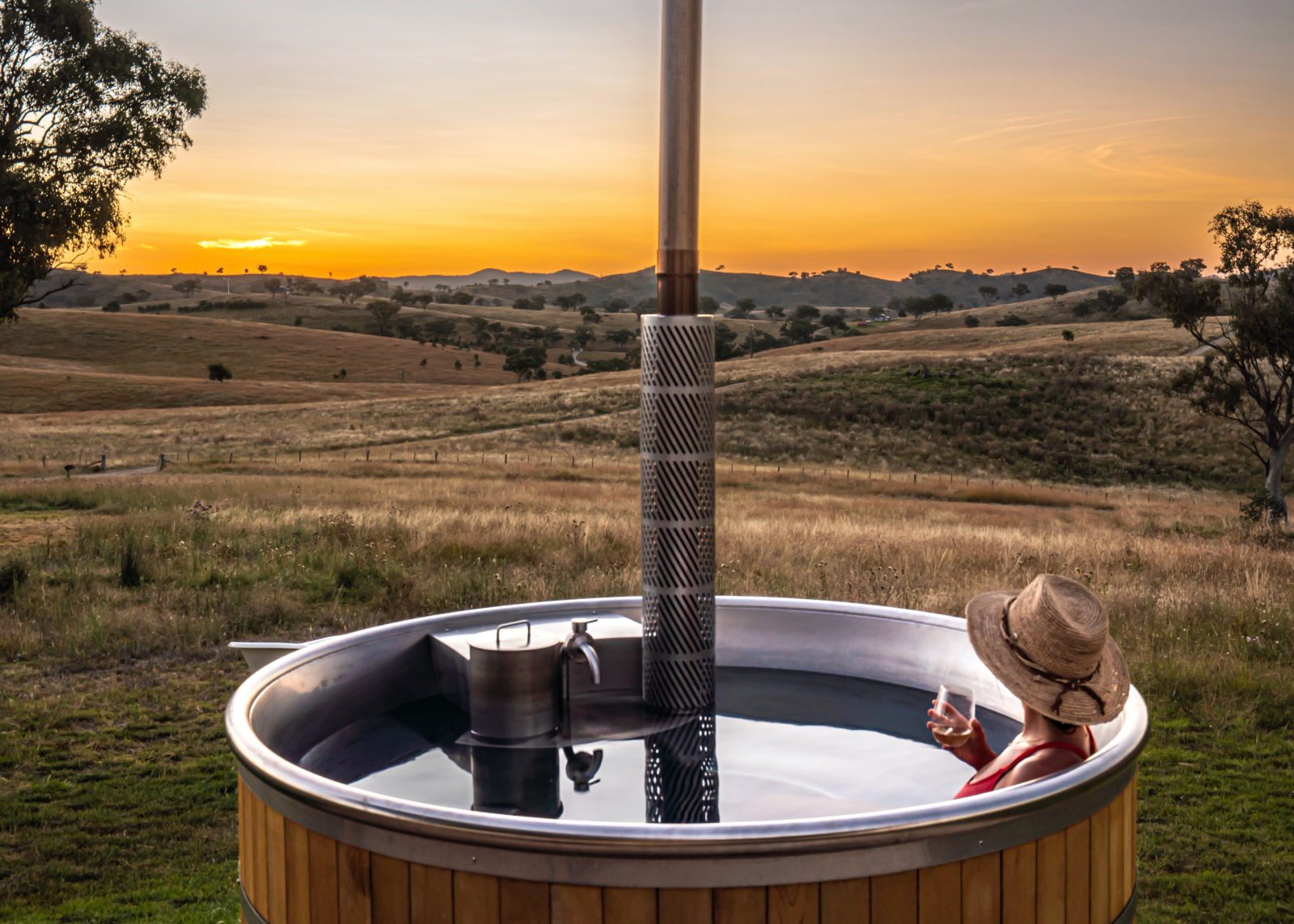 Enjoy watching the sunset in our wood fired hot tub sipping some Mudgee Wine