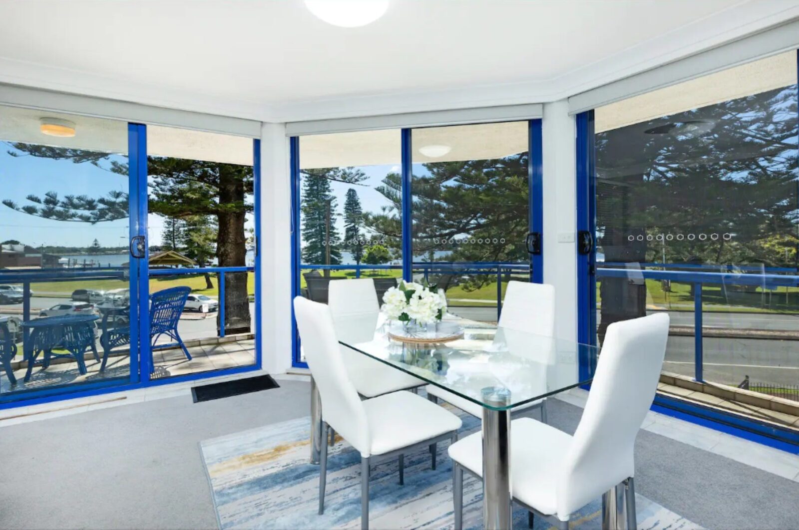 Dining room leading out to balcony with ocean views