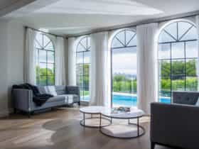 Living room giving views to the outdoor swimming pool