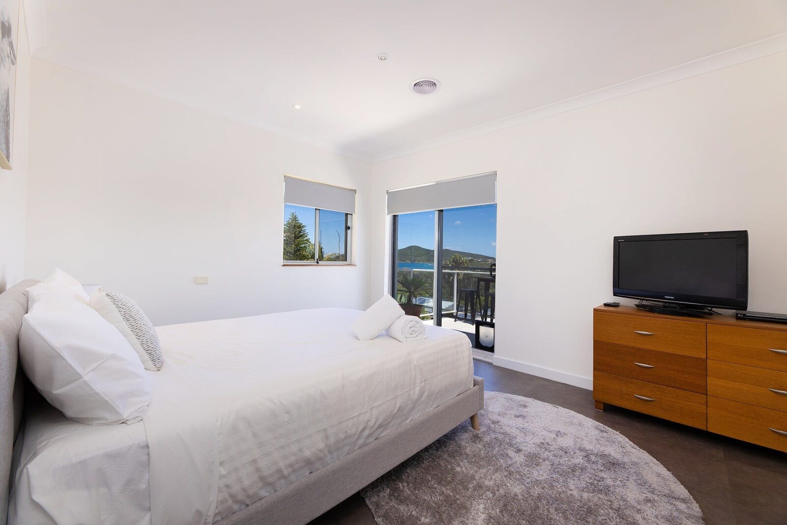 Bedroom with Queen bed, TV and ocean views