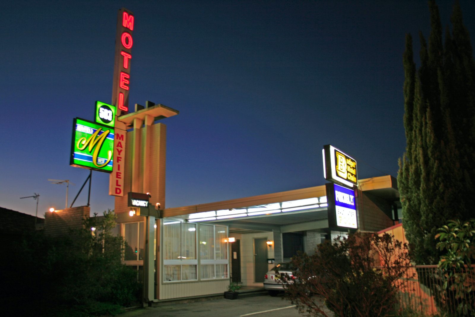 Mayfield Motel front entrance and classic neon signs at night