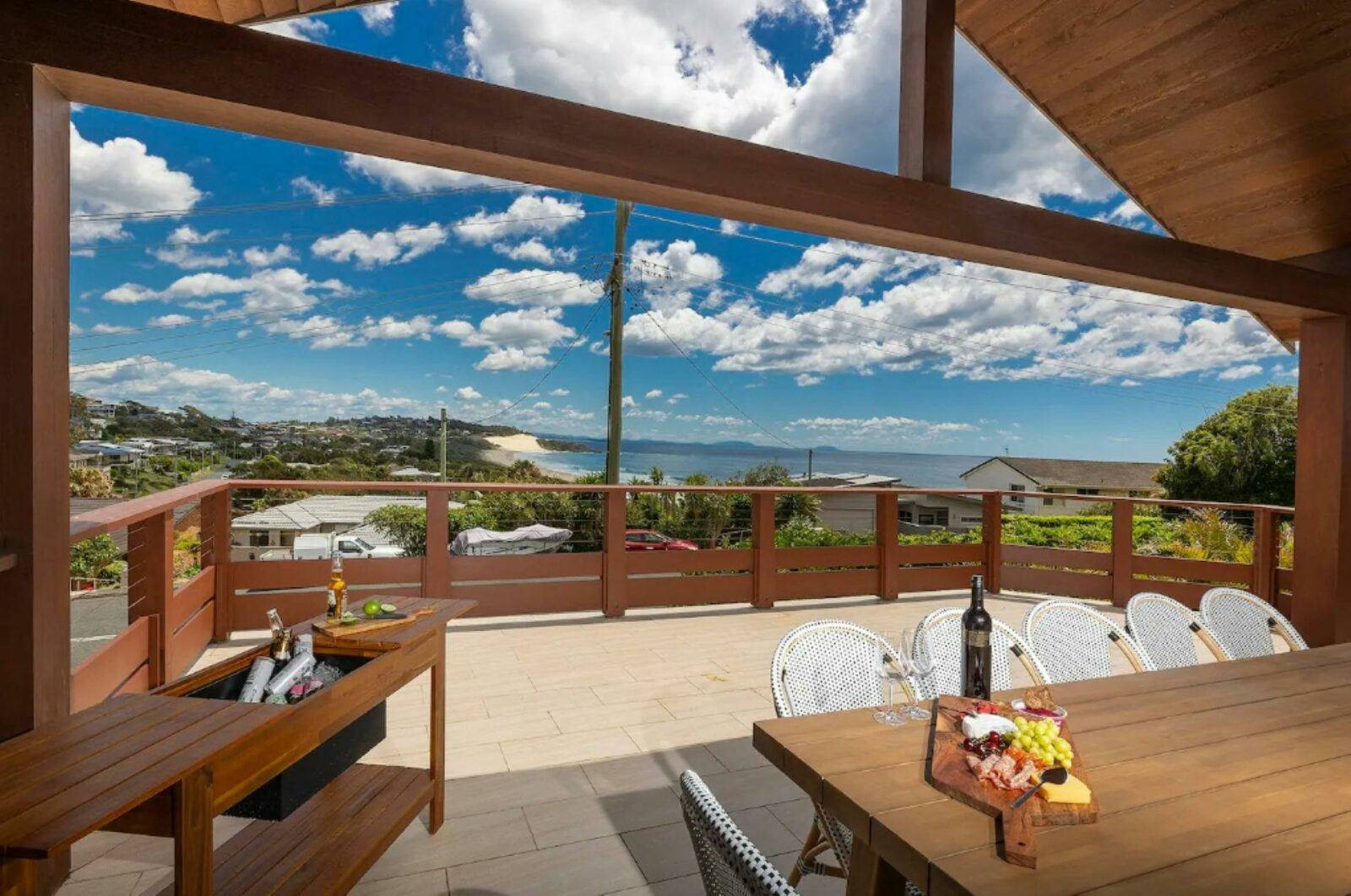 Spacious balcony with ocean views, dining setting