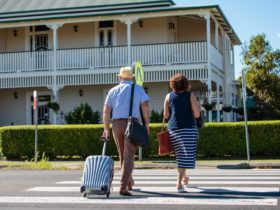 Couple walking towards check in at Riversleigh