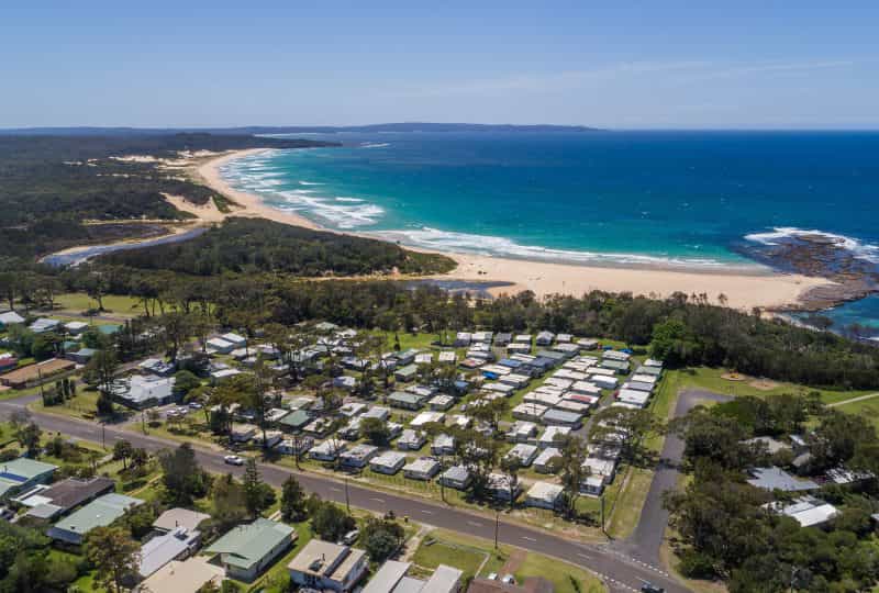 Aerial photo of Surfside Cudmirrah Beach looking north. We offer direct access to the beach.