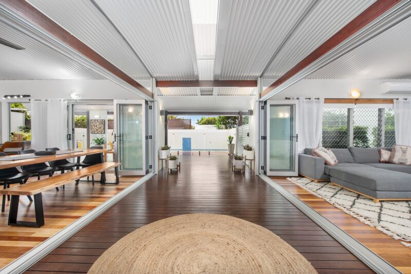 Step through the front door and into the Breezeway and take in the decks, pool, lounge & dining