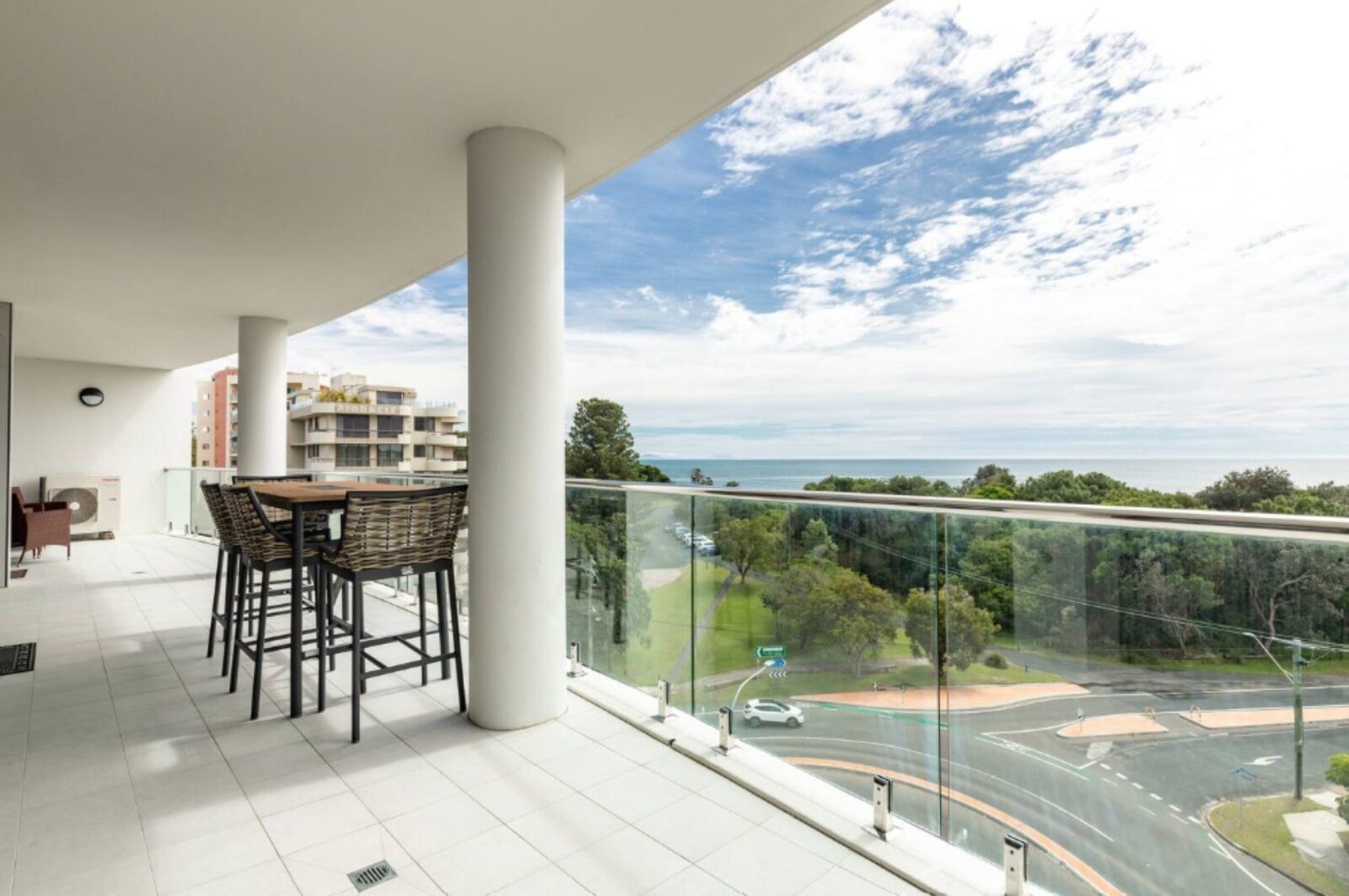 Balcony with outdoor setting and ocean views