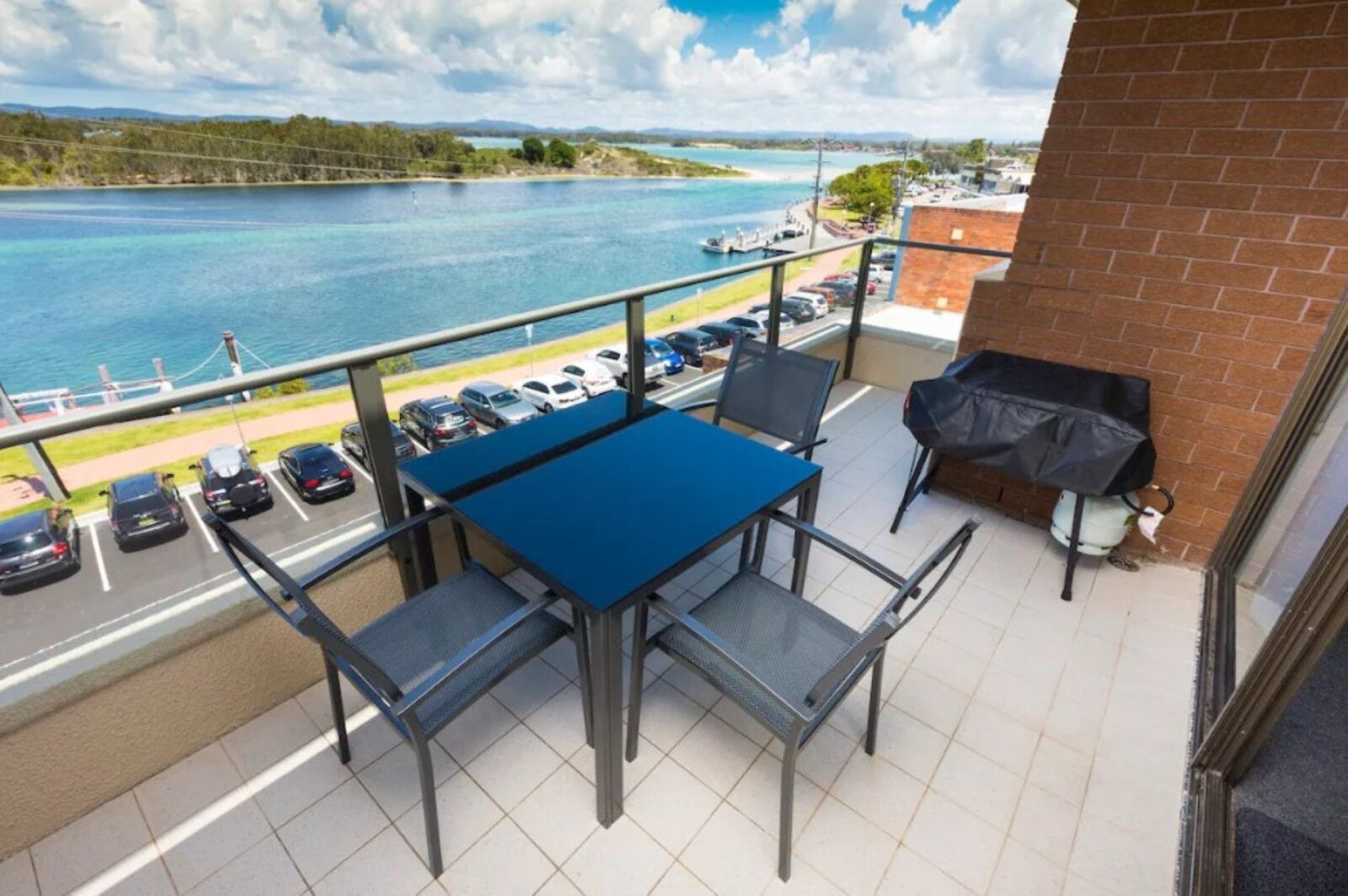 Balcony with lake views, dining setting and BBQ