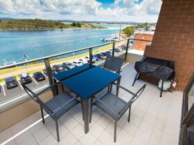 Balcony with lake views, dining setting and BBQ