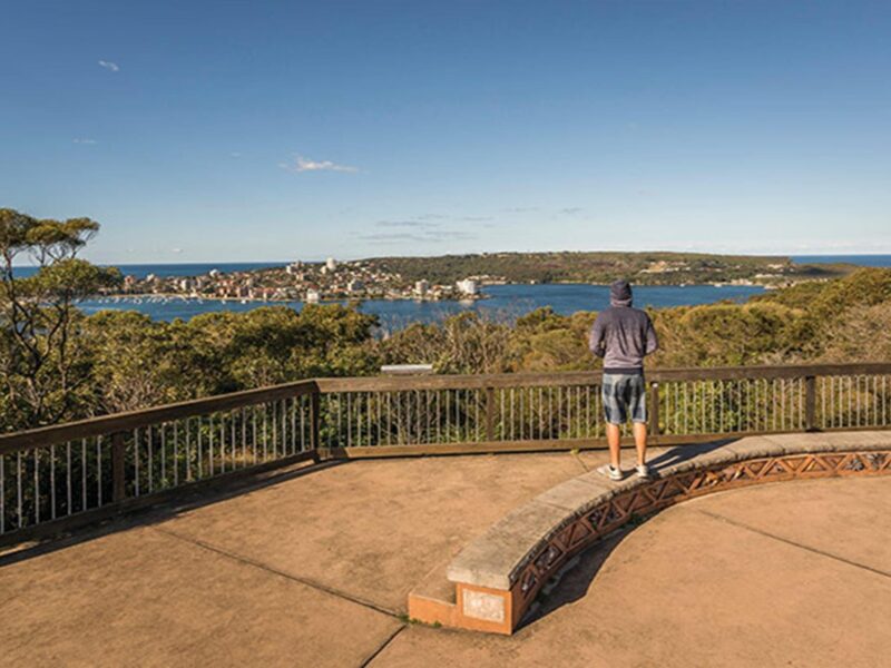 A man takes in views of Manly from Arabanoo lookout, Dobroyd Head, Sydney Harbour National Park.