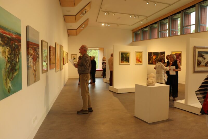 Photo of people looking at an exhibition