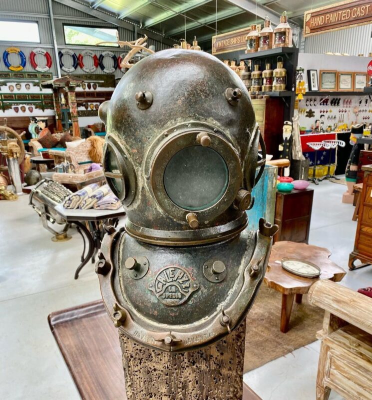 an old diving helmet on display at the antique centre