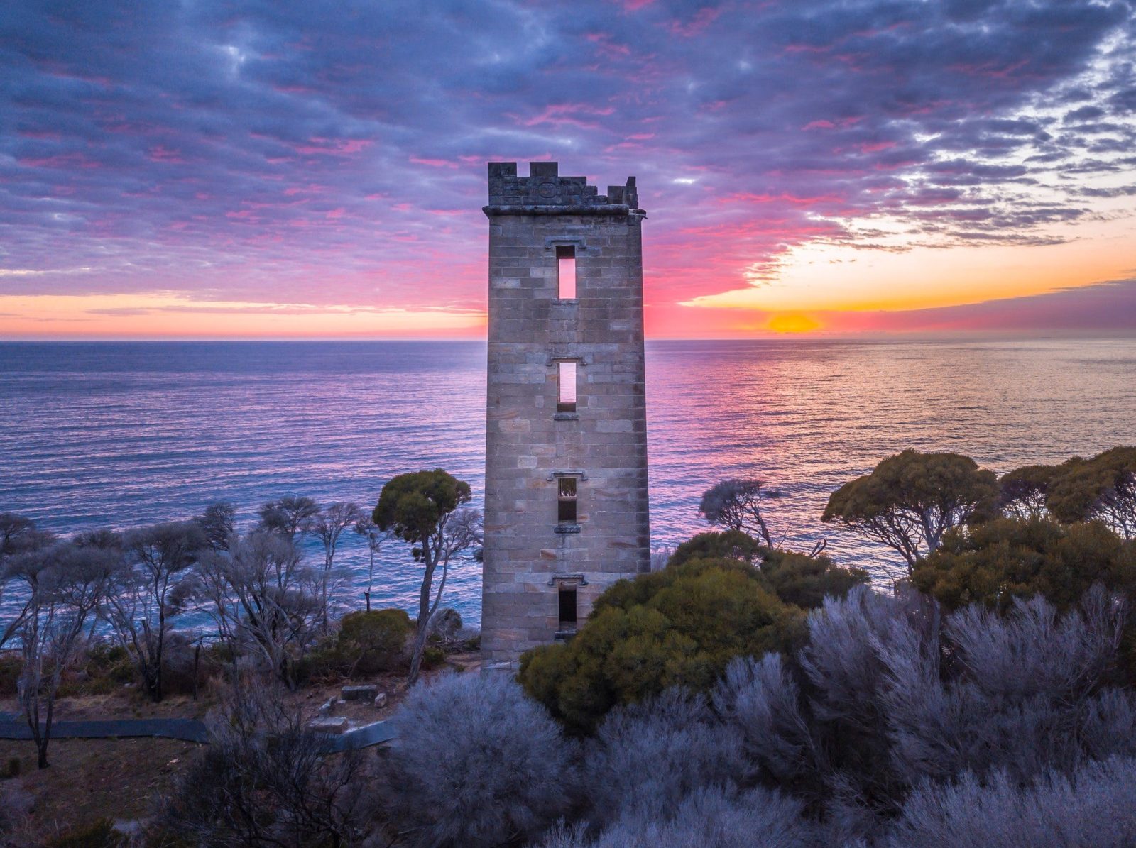 Sun rising over Boyd Tower on Red Point in the Ben Boyd National Park, Edrom
