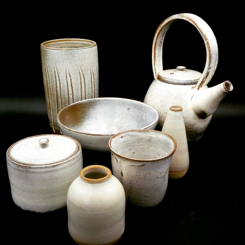 Set of handmade ceramic tableware items finished in an off white satin glaze.