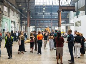 a group of people walking milling around the Public Space of Carriageworks