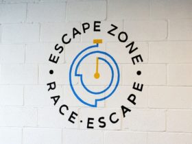 Escape Zone Logo. Visit us to try our escape rooms or racing simulator.