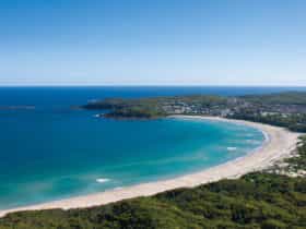 Coastal aerial of Fingal Beach in Fingal Bay, Port Stephens