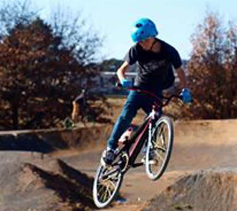 Teenager on BMX riding the track