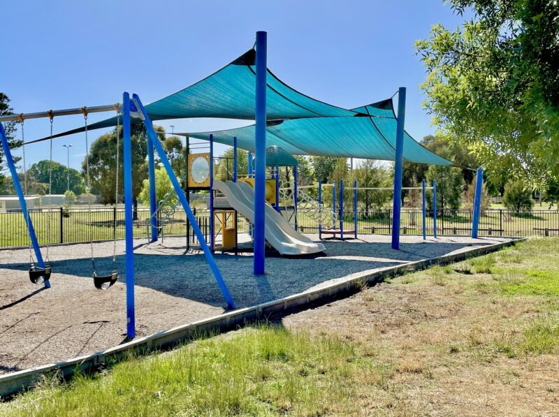 Playground with slide, swings and climbing equipment