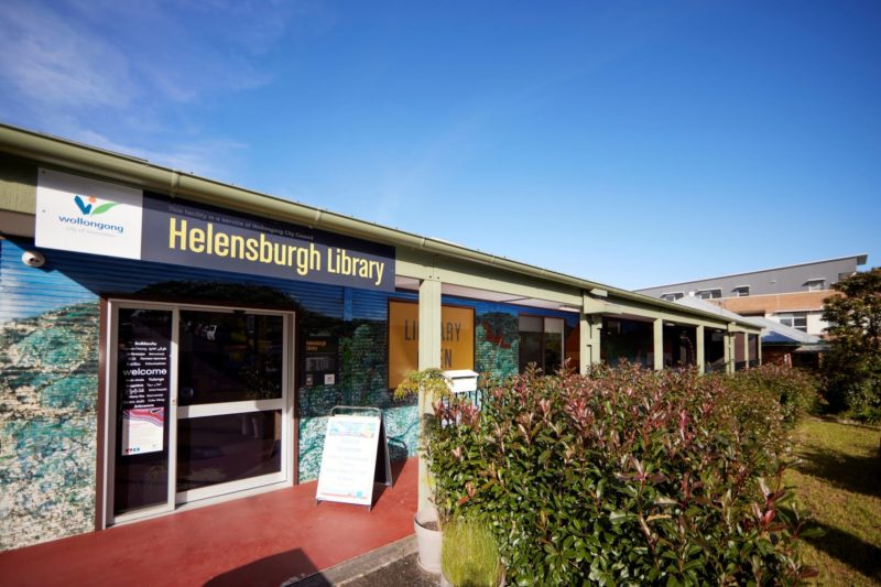 Main entrance to Helensburgh Library with bushes out the front