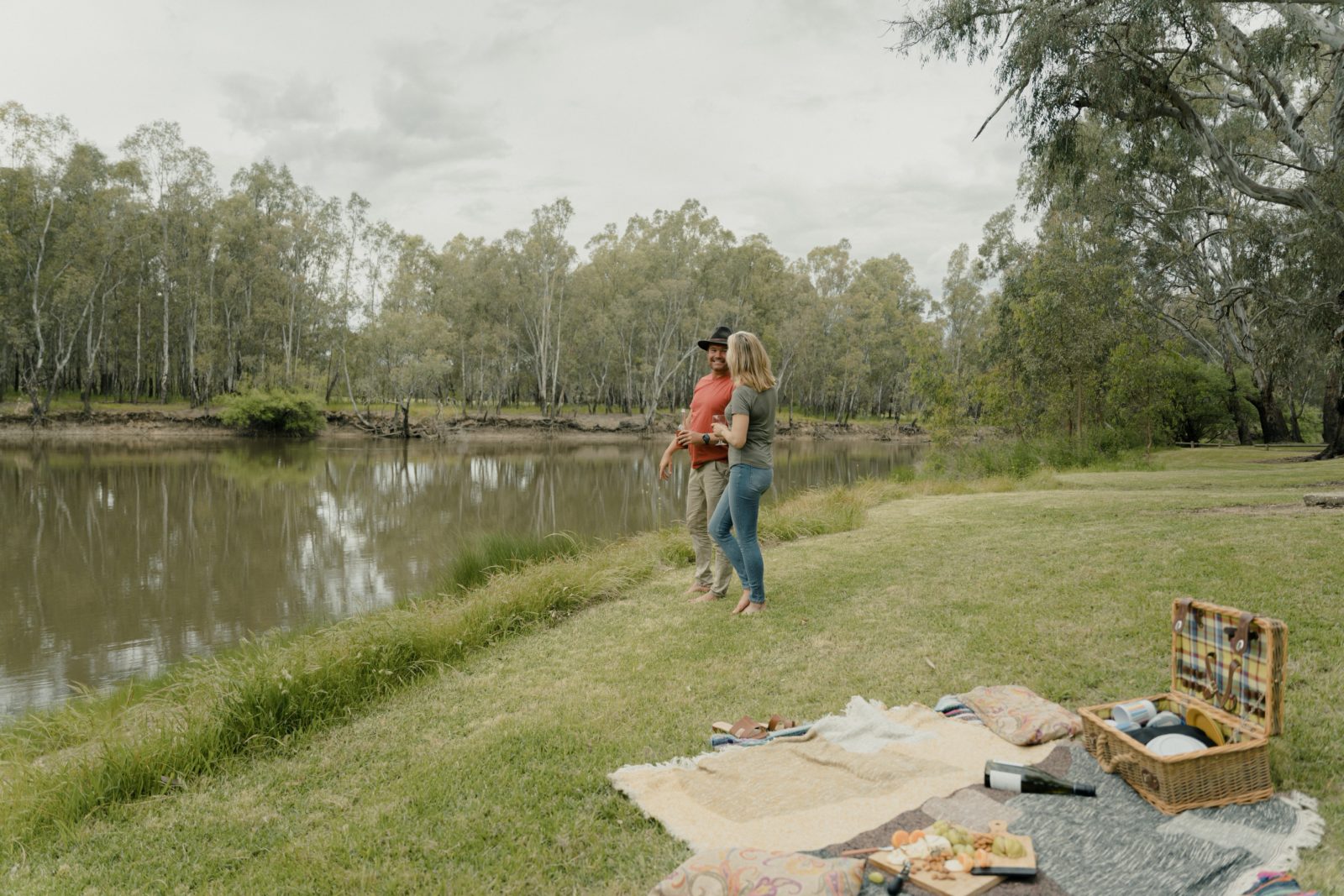 Couple picnicking on the banks of the Murray River at Lions Park Howlong
