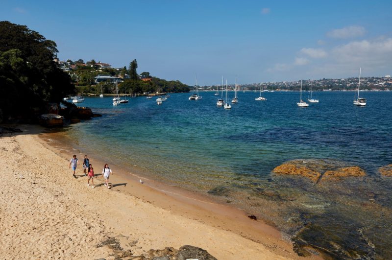 Friends enjoying a walk along Milk Beach on the Hermitage Foreshore Track, Vaucluse in Sydney