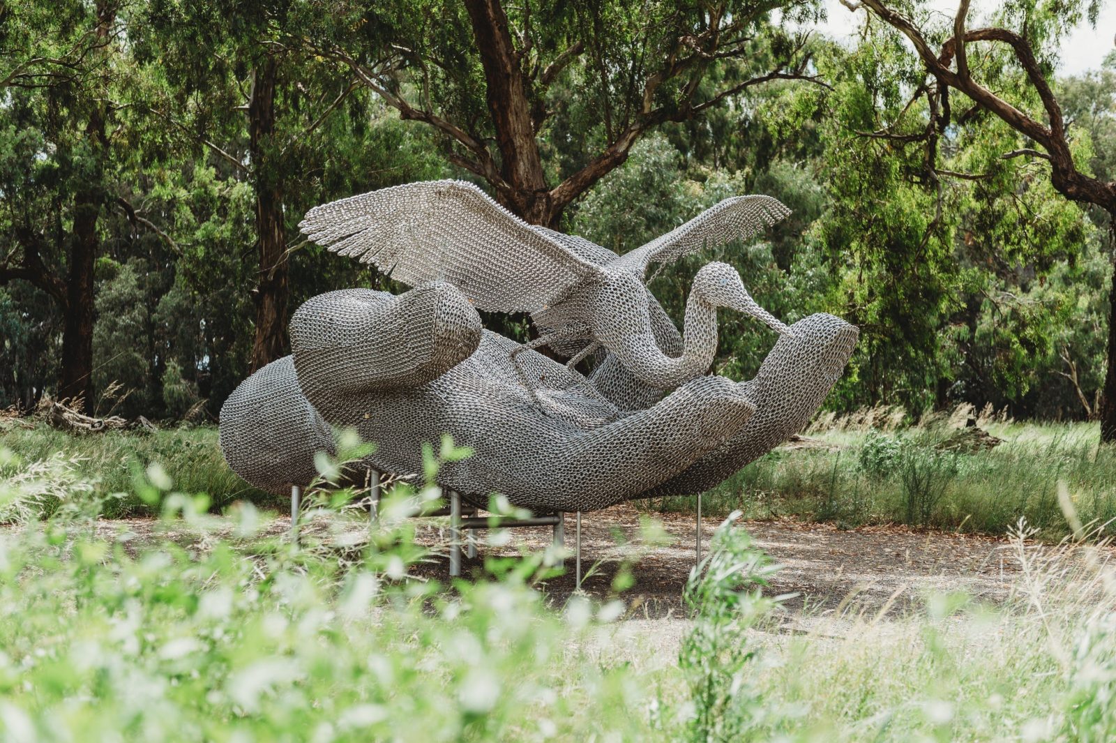 Sculpture of hand holding a bird