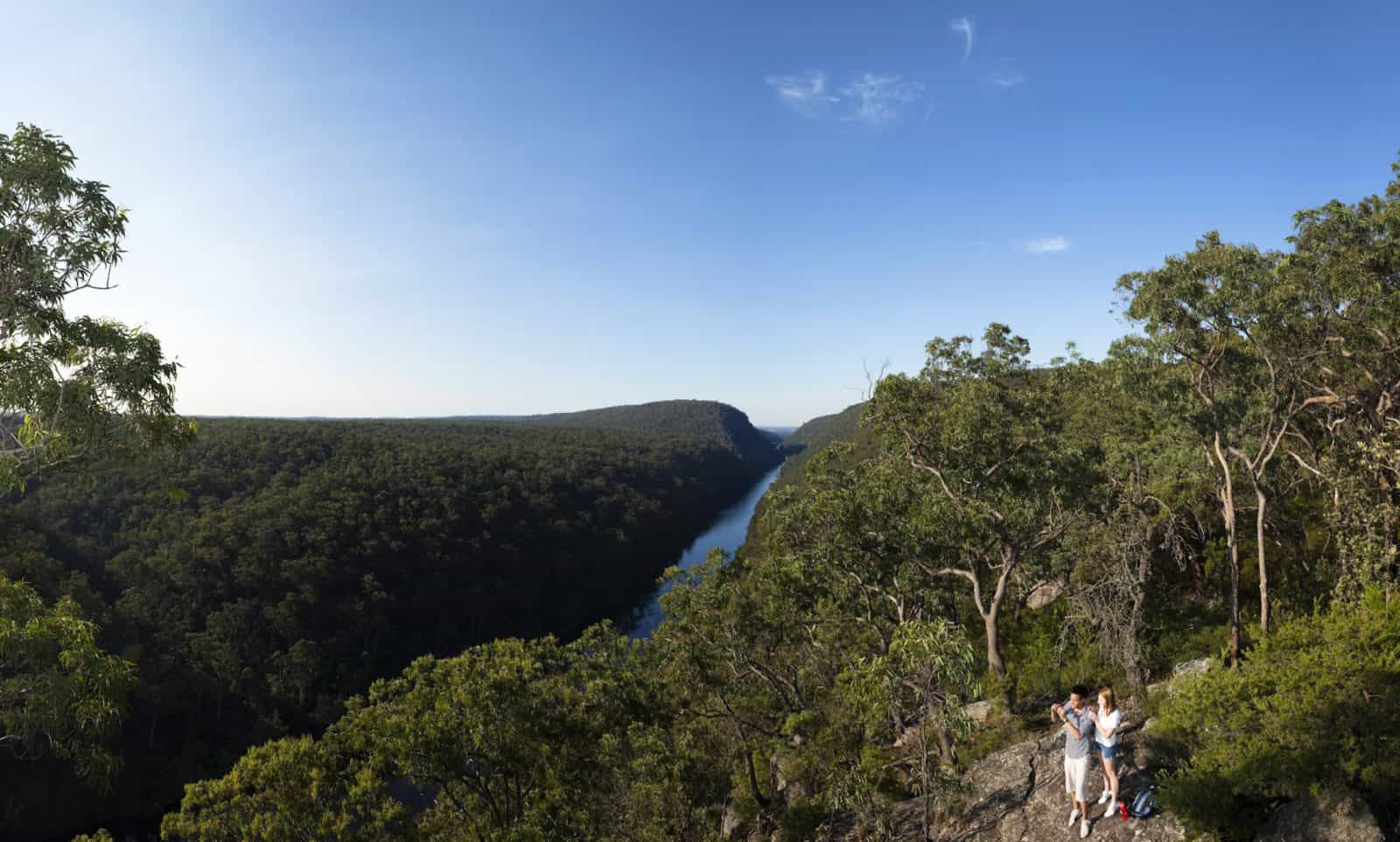 Couple walking near 'The Rock' lookout at Nepean River, Penrith