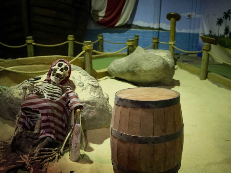 Shipwrecked skeleton beside mini golf course