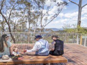Visitors enjoying panoramic views of the Jamison Valley from Valley of the Waters lookout. Photo:
