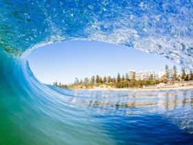 North Beach Wollongong through the natural frame of an ocean wave