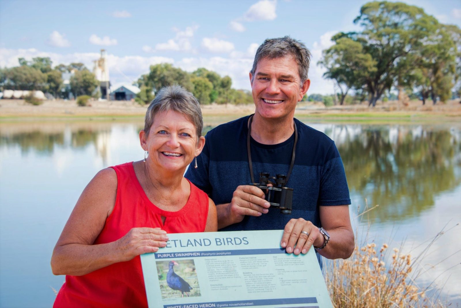 couple standing wit hthe bird life sign at the Corowa Wetlands
