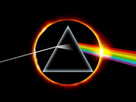 Solar eclipse surrounds a prism, where light enters and is refracted out, showing rainbow colours