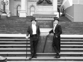 David Hobson and Colin Lane standing on steps