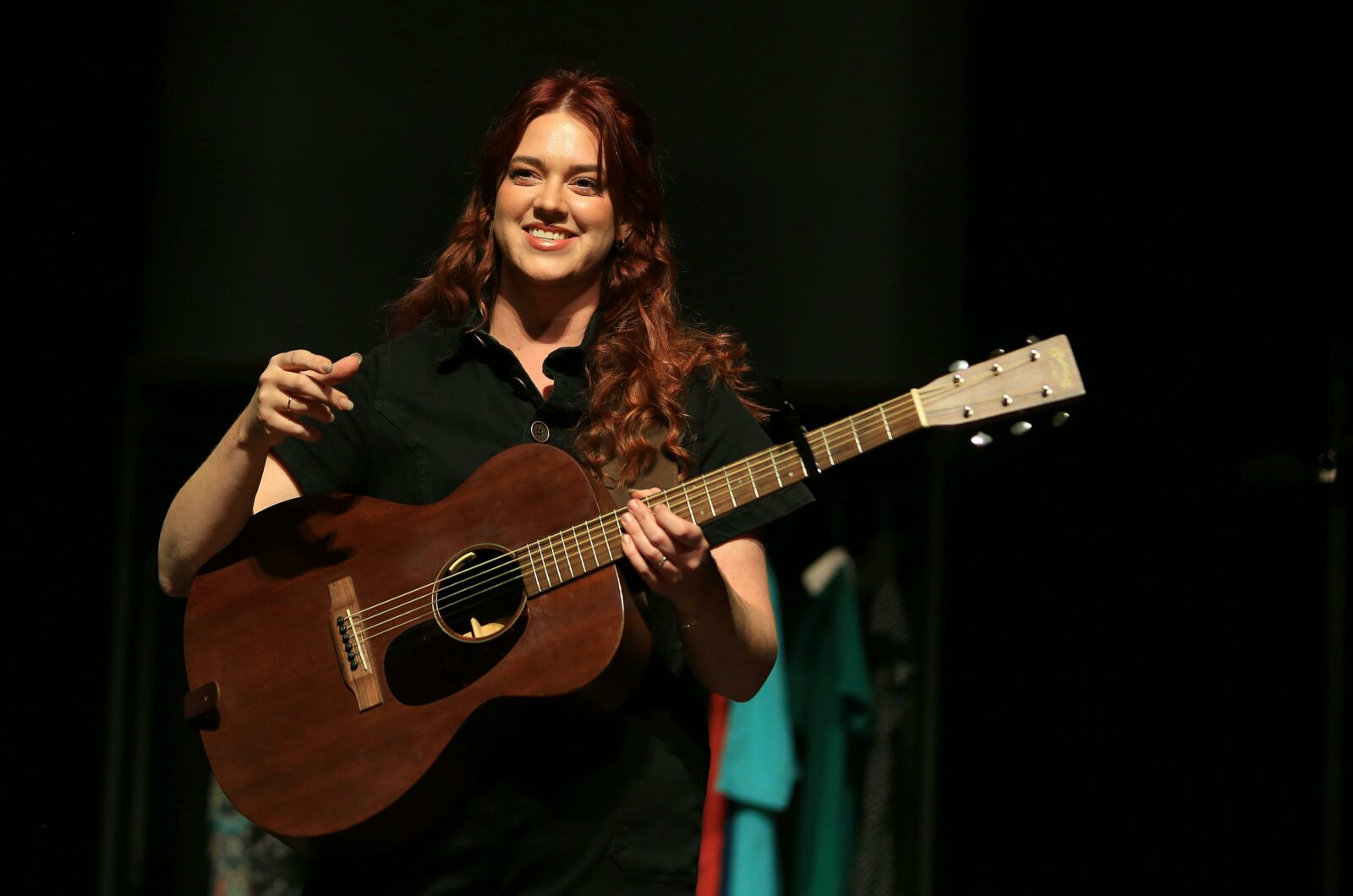 woman playing guitar