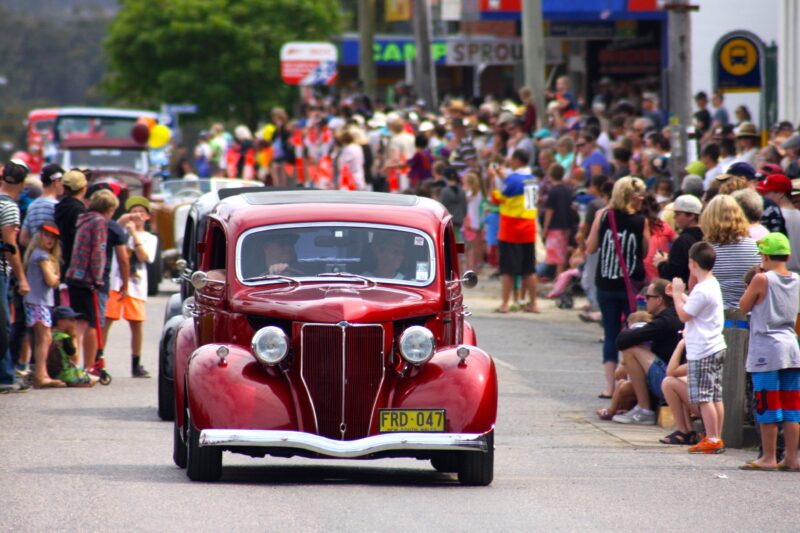 Old cars in a street parade