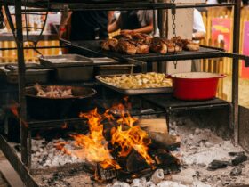 Cooking food over fire at a live open outdoor event
