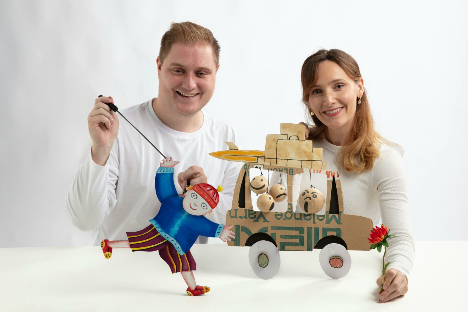 Manon Gunderson-Briggs Fabio Jaconelli pose with cutout puppets