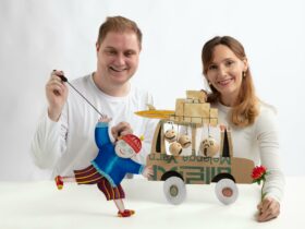 Manon Gunderson-Briggs Fabio Jaconelli pose with cutout puppets