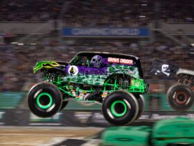 Monster Truck flying across a stadium at great speed