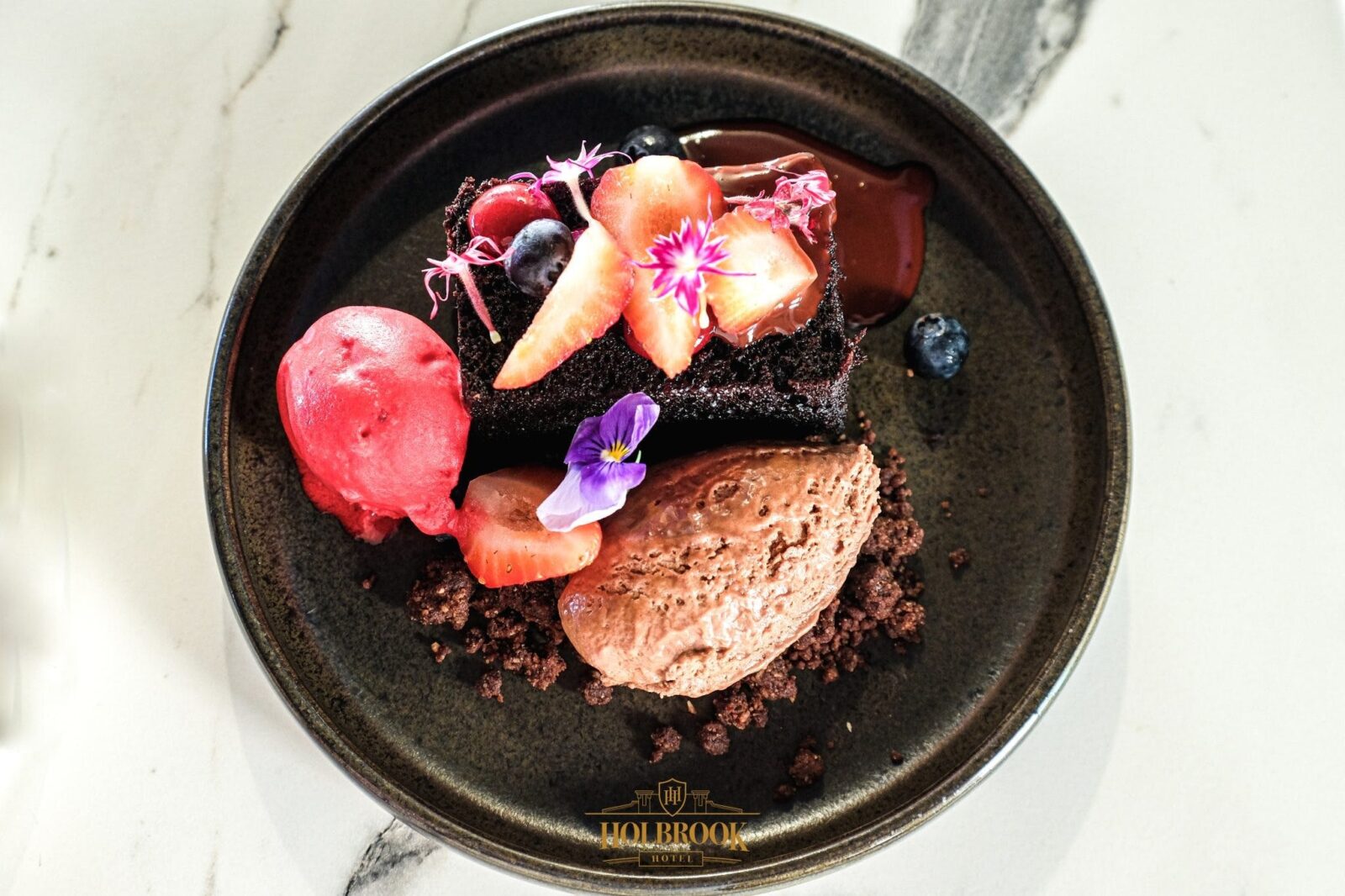 Chocolate Dessert with fresh fruit and edible flowers