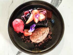 Chocolate Dessert with fresh fruit and edible flowers
