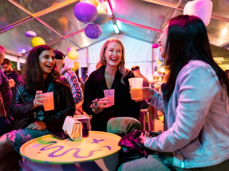 People laughing at pop-up bar