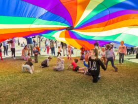 Kids playing under rainbow tent