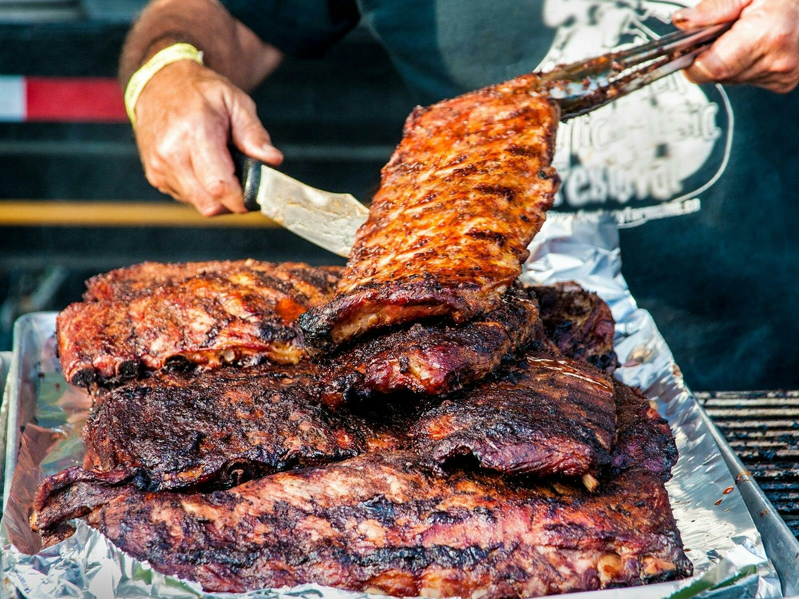 Competitor serving pork ribs