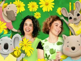 Two women smiling surrounded by animated animals and yellow flowers