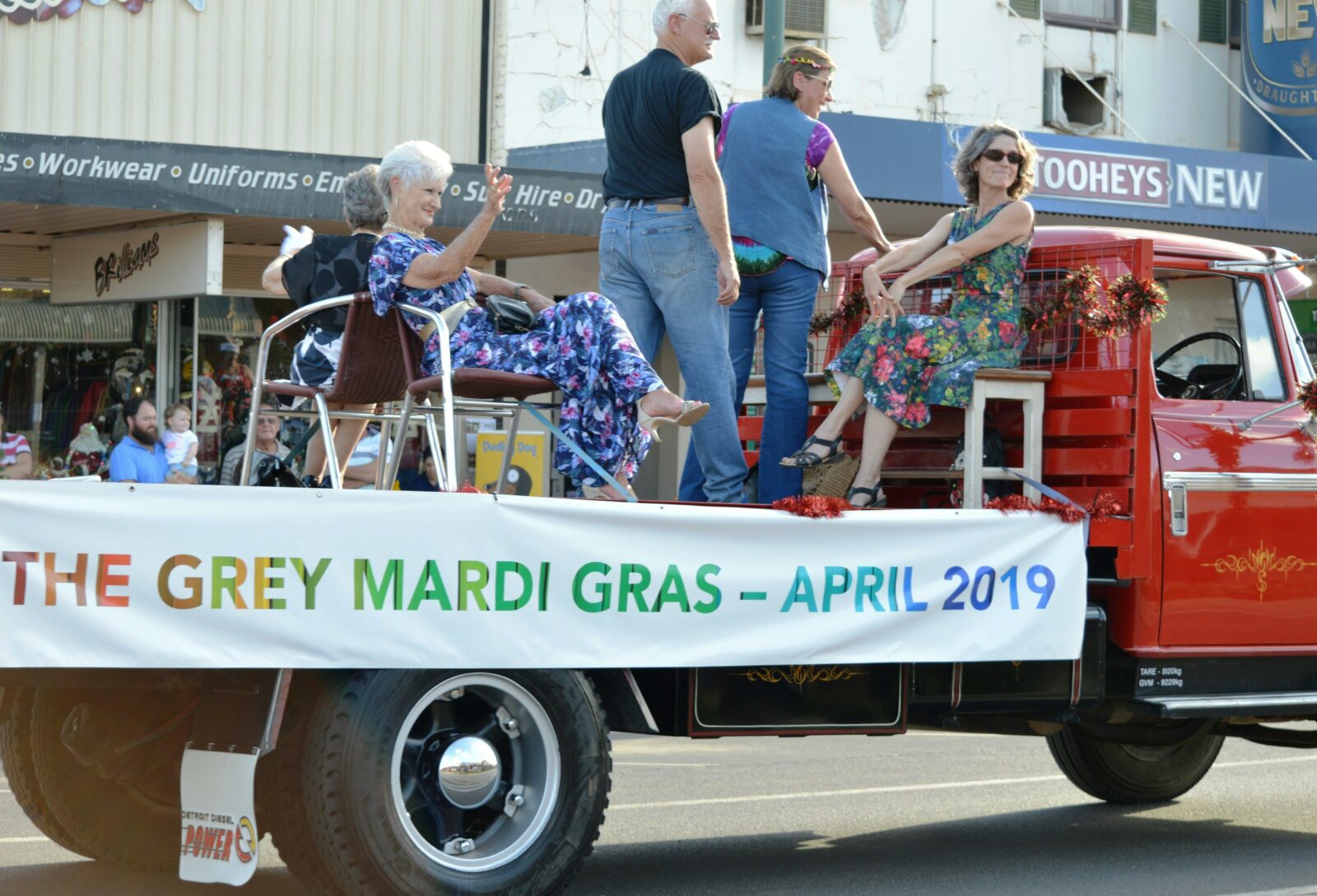 People in vintage costume on a truck for a parade in Cobar