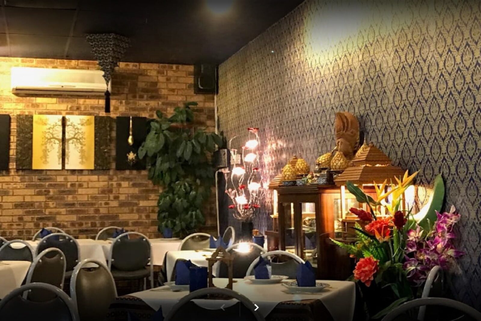 Image of tables and chairs set up ready for service inside Bangkok Thai restaurant