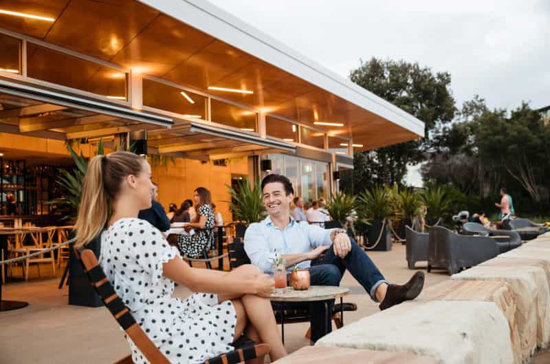 Couple Enjoying evening drinks at The BOX on the Water restaurant and bar, Ettalong Beach