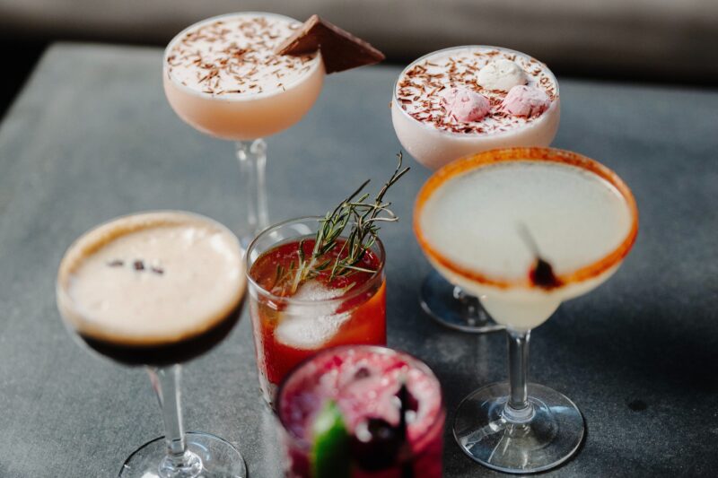an assortment of six different cocktails